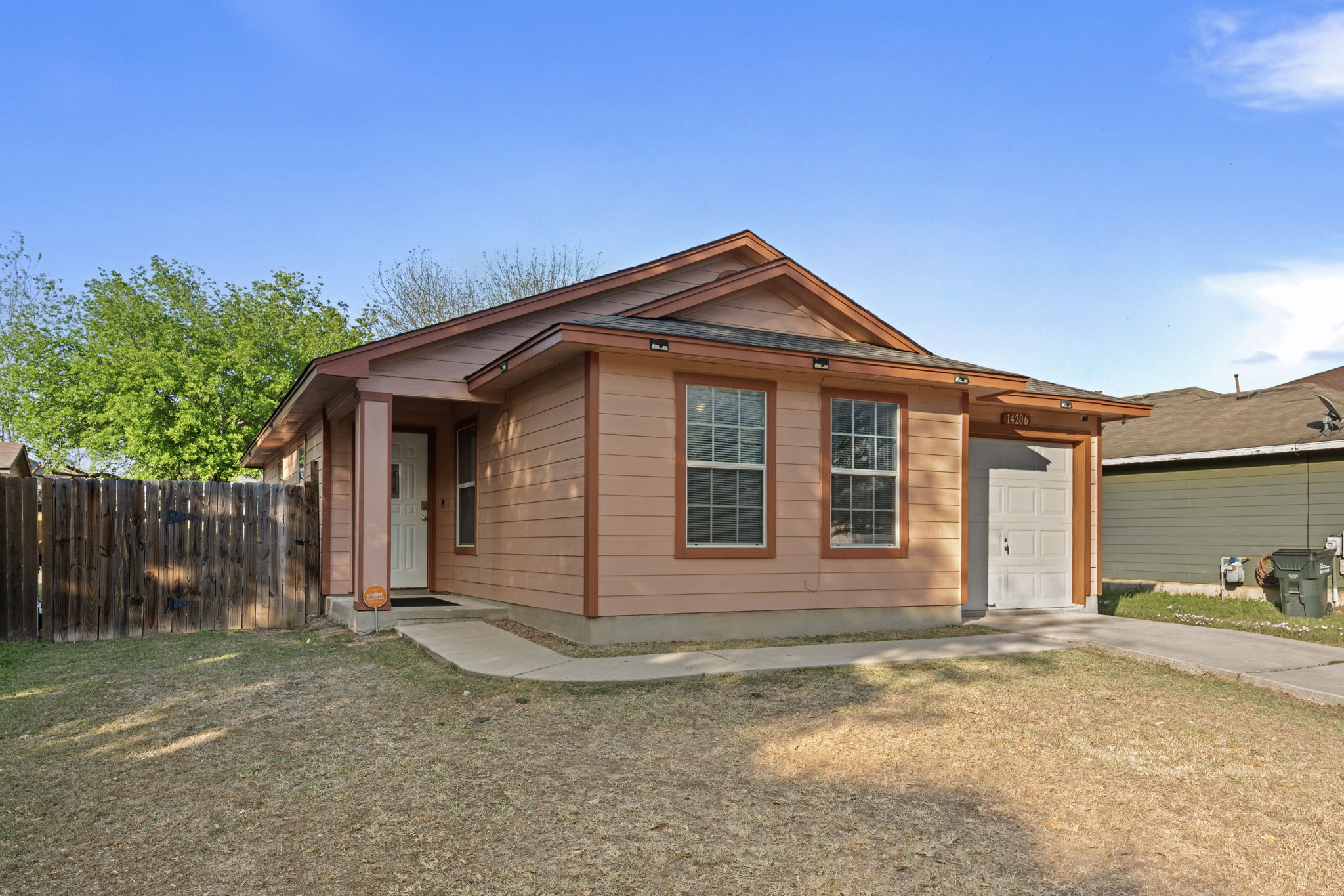 14206 Varrelman Street Austin, TX 78725 - Photo 3 of 27 a front view of a house with a yard