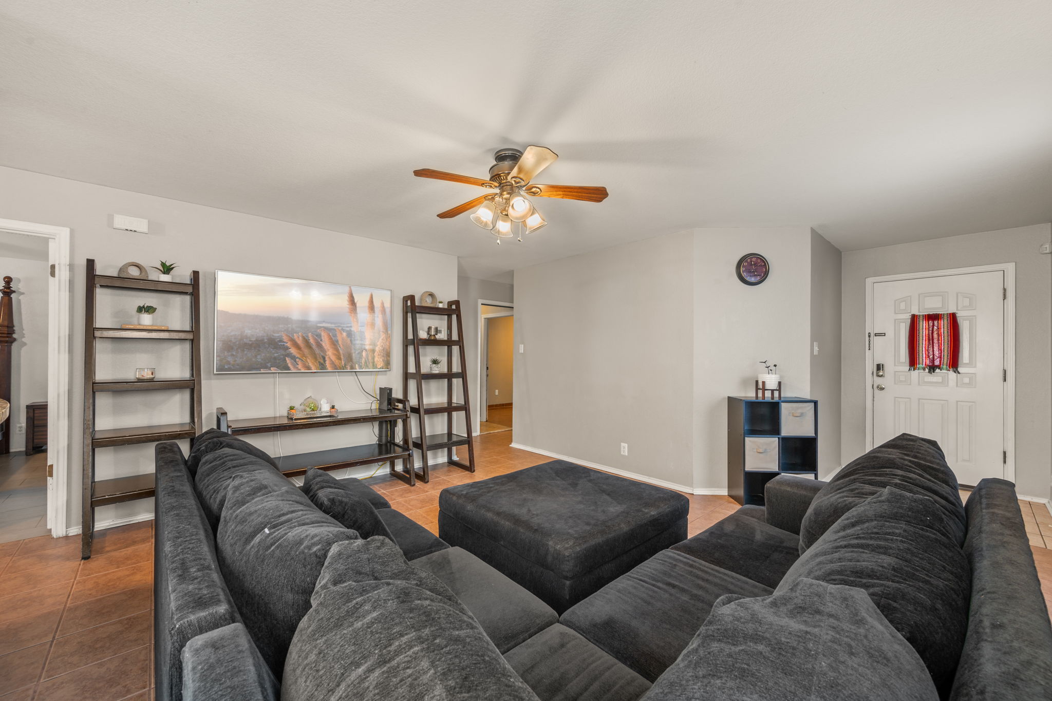 14206 Varrelman Street Austin, TX 78725 - Photo 7 of 27 a living room with furniture a ceiling fan and a window