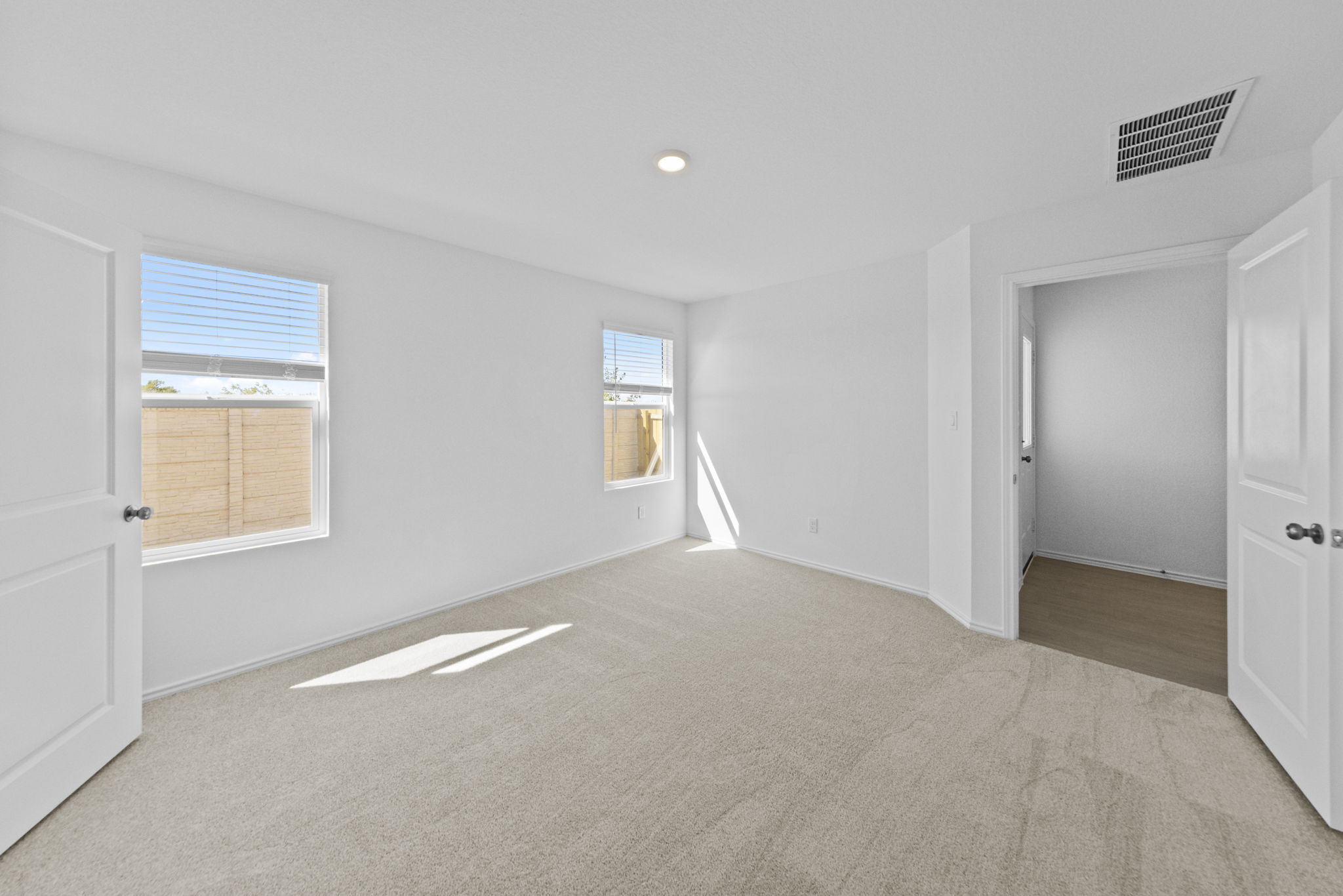 945 Soapstone Pass Maxwell, TX 78656 - Photo 17 of 19 an empty room with windows