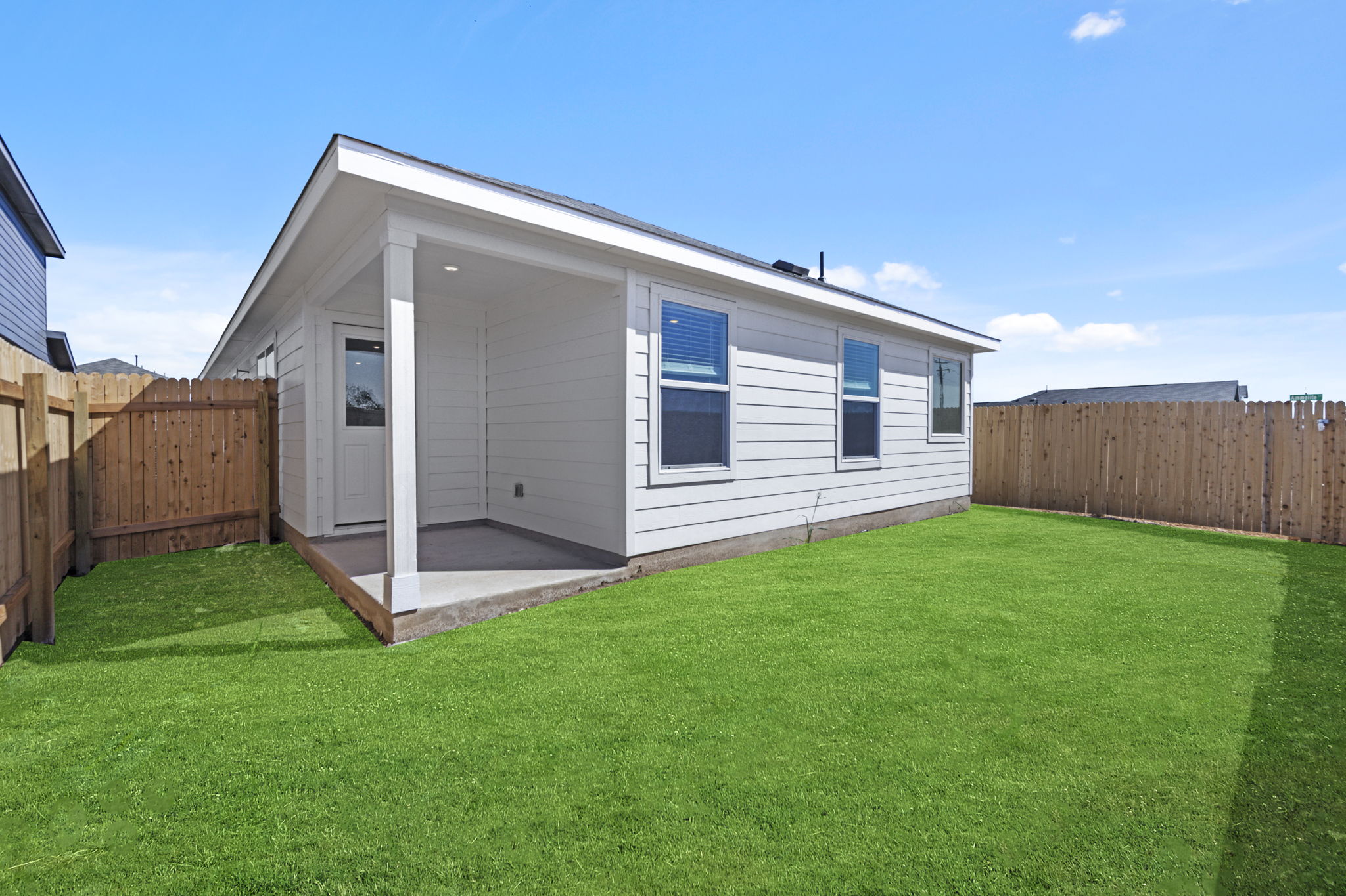 945 Soapstone Pass Maxwell, TX 78656 - Photo 3 of 19 a view of a back yard of the house