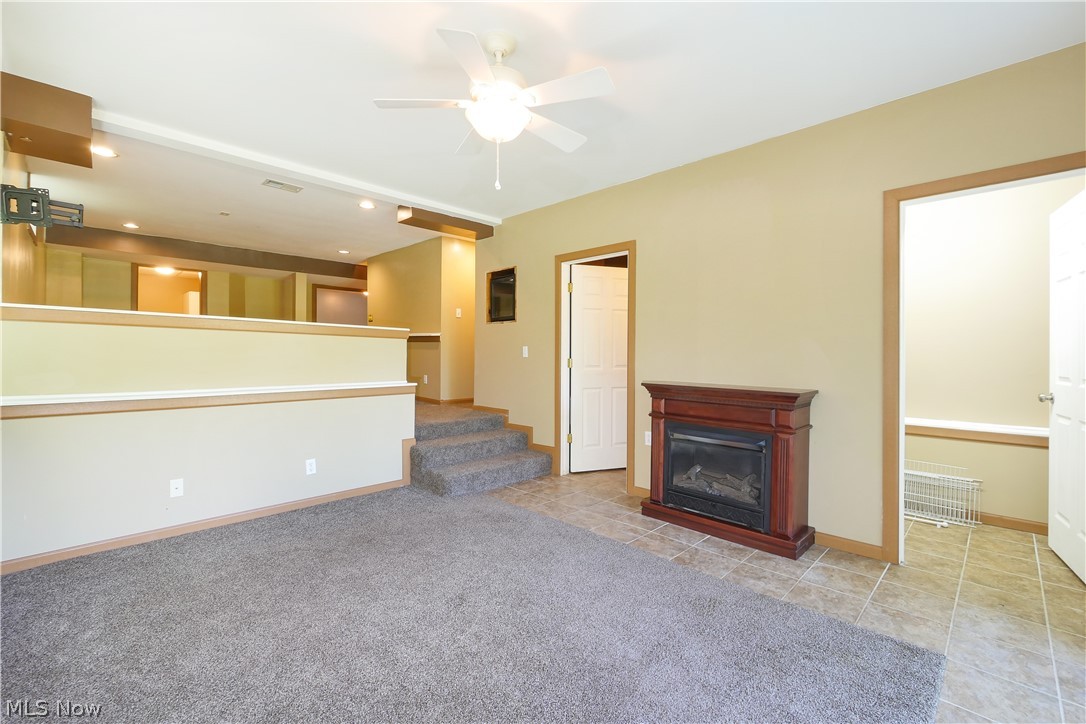 6475 Kungle Road Clinton, OH 44216 - Photo 31 of 35 Finished walkout basement with additional room, laundry room, and half bath