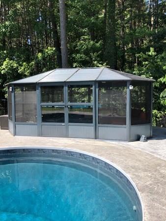 20 Patterson Road Shirley, MA 01464 - Photo 7 of 27 a backyard of a house with yard barbeque oven and outdoor seating