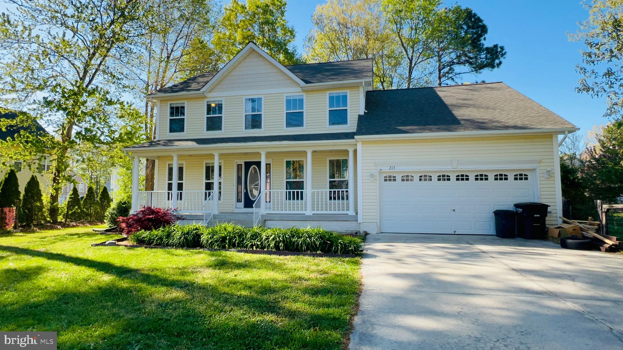 213 Forest Avenue Colonial Beach, VA 22443 - Photo 2 of 54 a front view of house with yard and green space