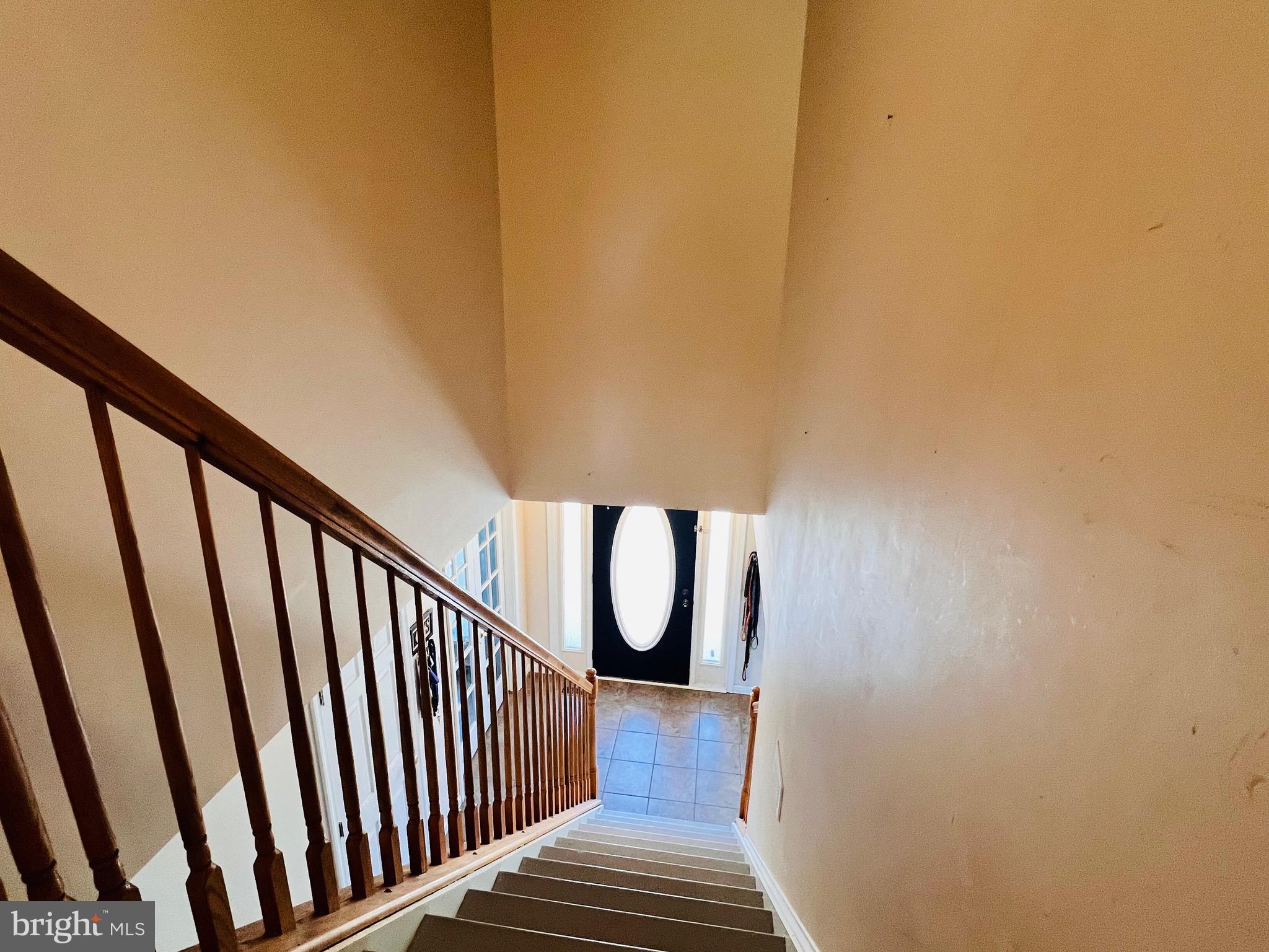 213 Forest Avenue Colonial Beach, VA 22443 - Photo 21 of 54 a view of staircase with railing and a window