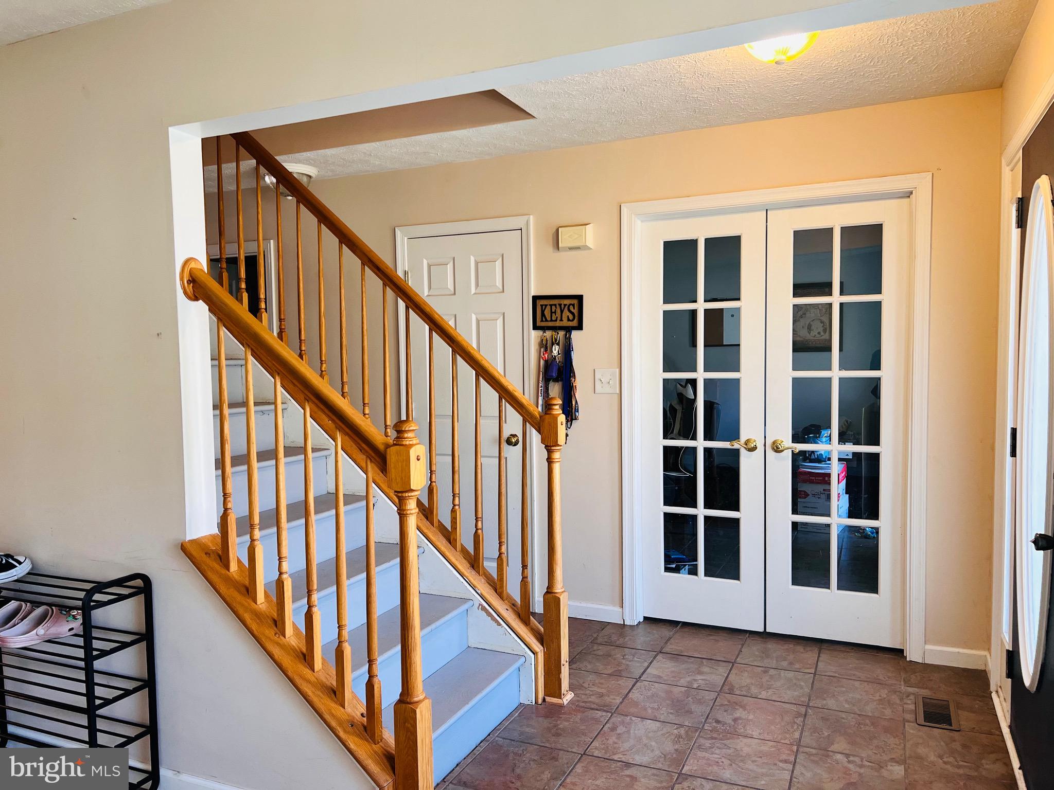 213 Forest Avenue Colonial Beach, VA 22443 - Photo 36 of 54 a view of staircase with lots of windows