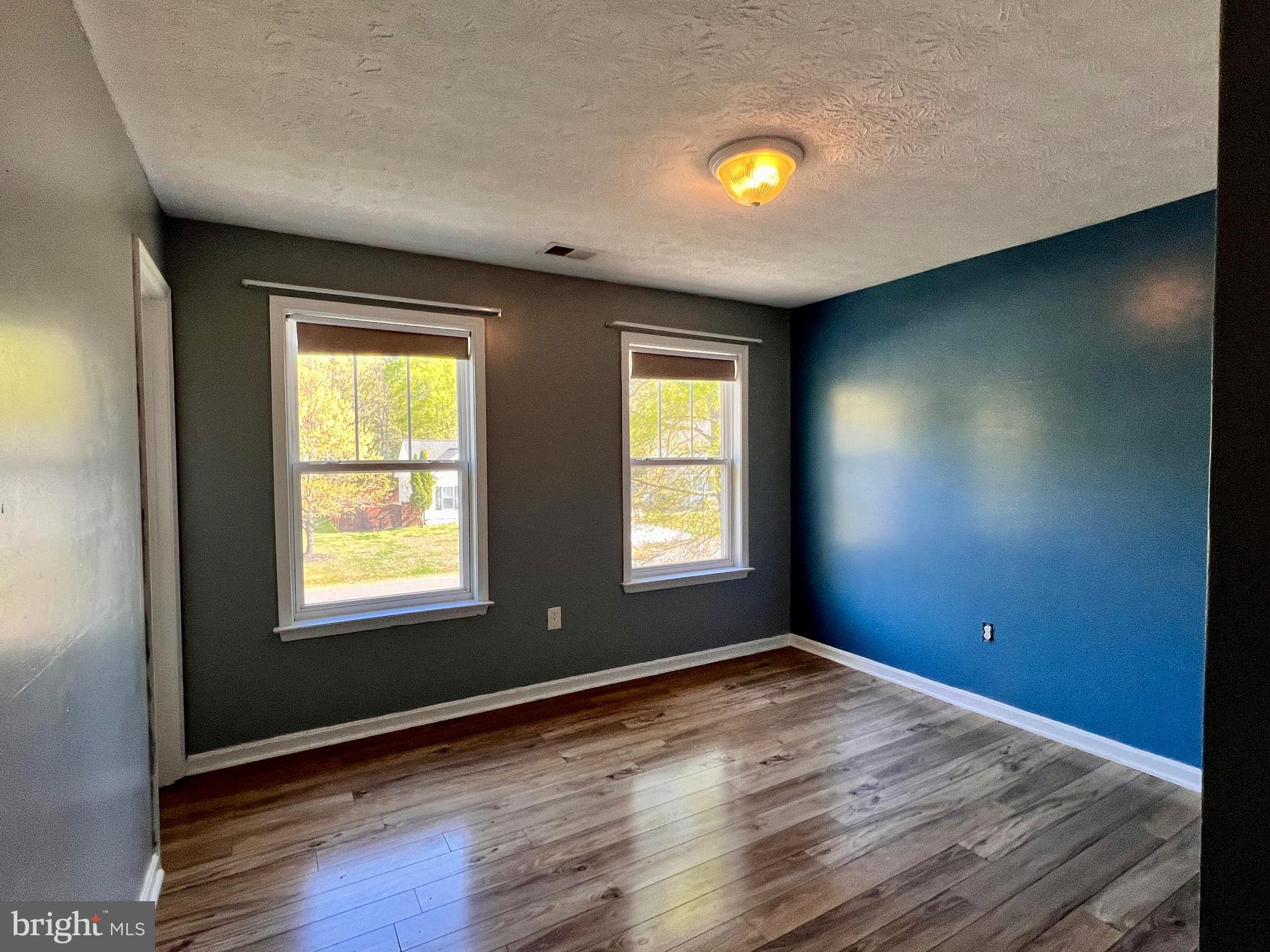 213 Forest Avenue Colonial Beach, VA 22443 - Photo 47 of 54 an empty room with windows and closet