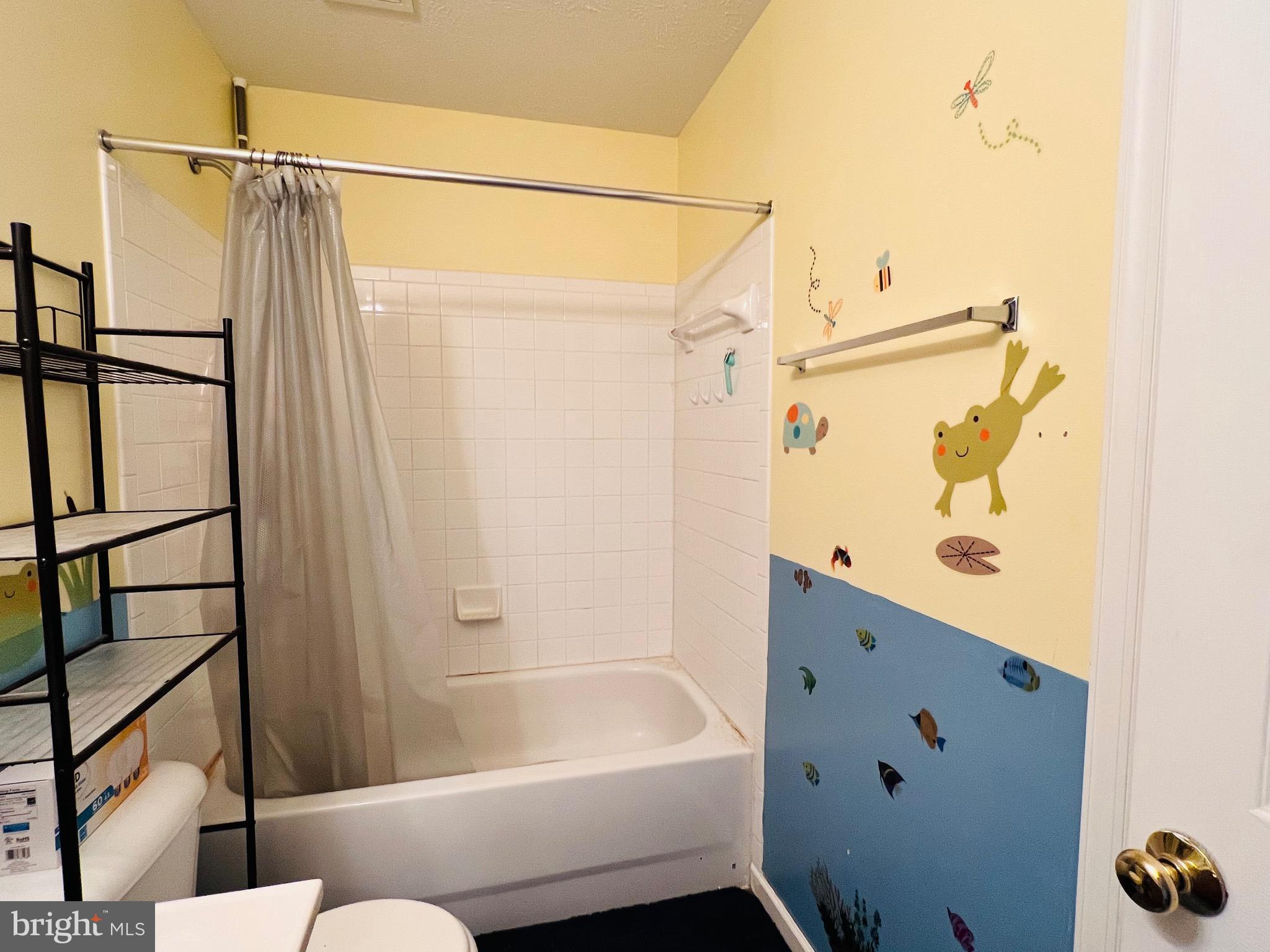 213 Forest Avenue Colonial Beach, VA 22443 - Photo 50 of 54 a bathroom with a bathtub and a shower