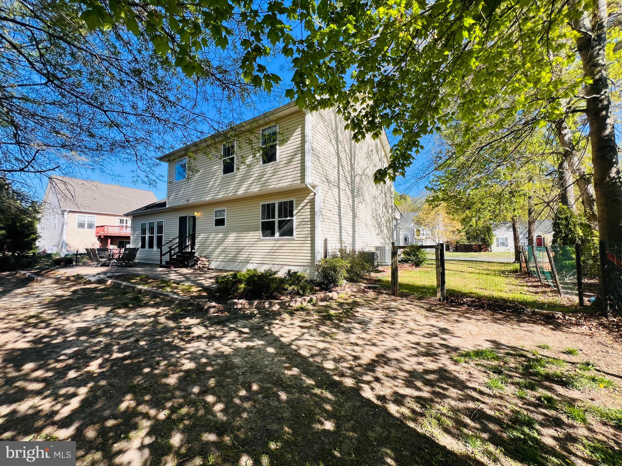 213 Forest Avenue Colonial Beach, VA 22443 - Photo 5 of 54 a front view of a house with a yard