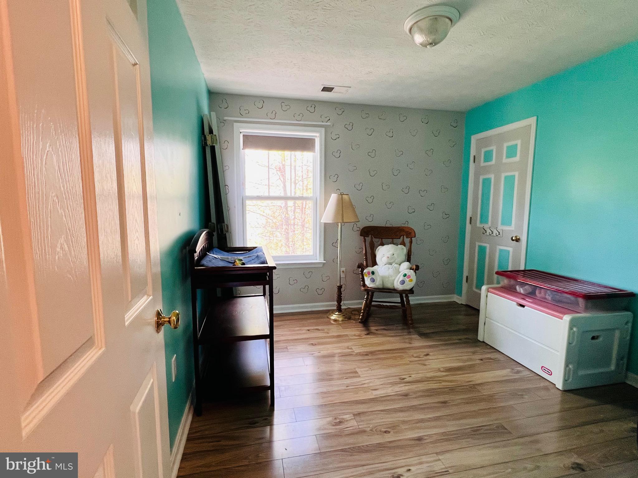 213 Forest Avenue Colonial Beach, VA 22443 - Photo 53 of 54 a living room with furniture and a window