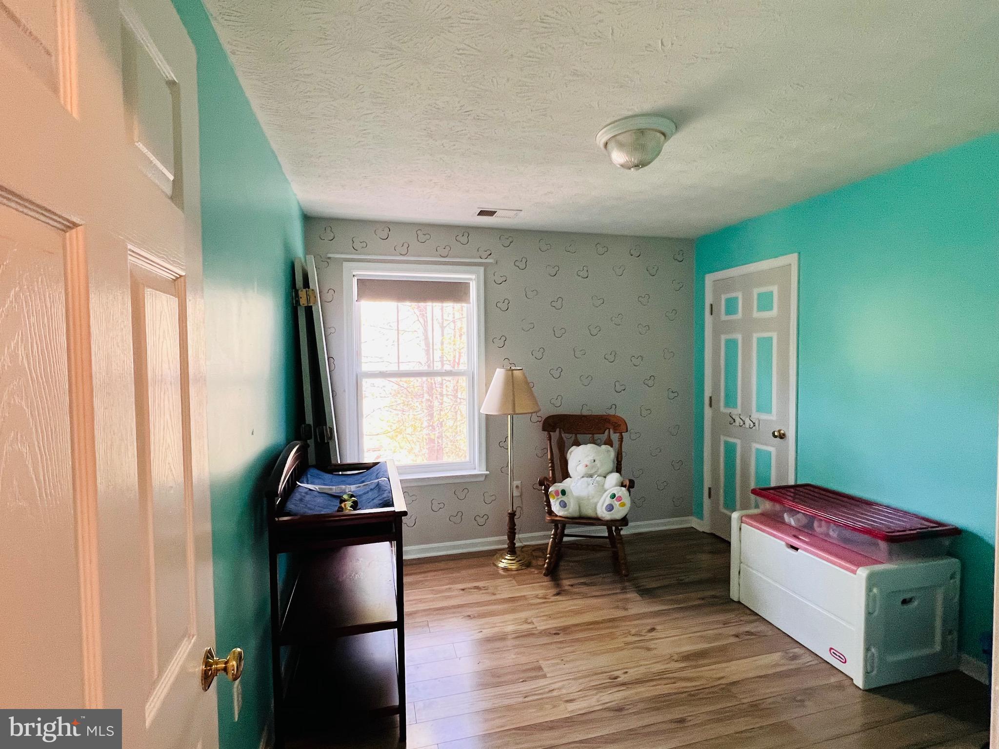 213 Forest Avenue Colonial Beach, VA 22443 - Photo 54 of 54 a living room with furniture and a window