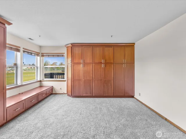 a view of a room with a window and a bathroom