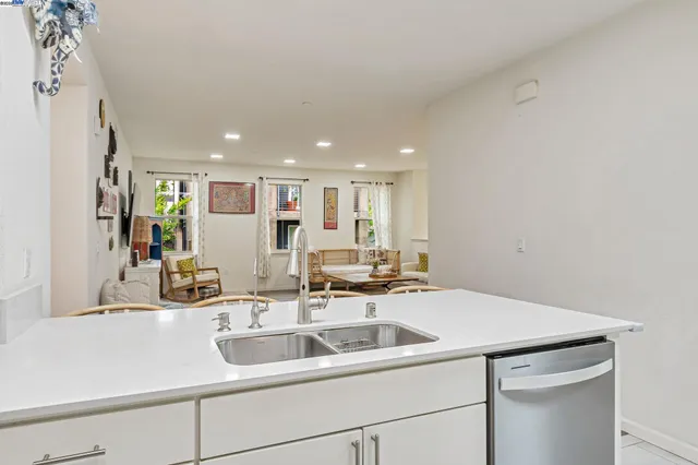 a kitchen with a sink and a refrigerator