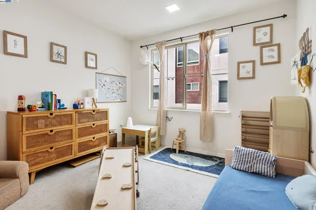a bedroom with furniture and a window