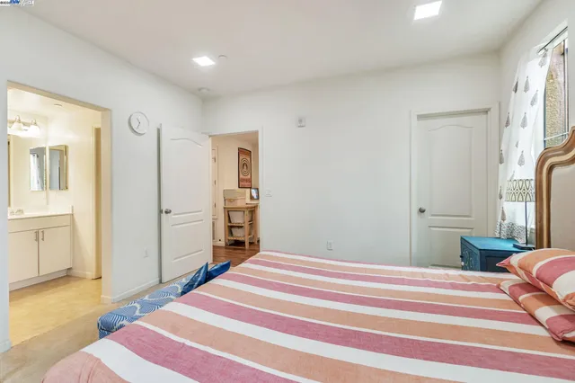 a bedroom with a bed and a view of bathroom