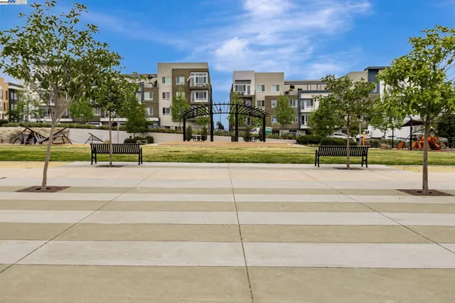 a view of a house with swimming pool and sitting area