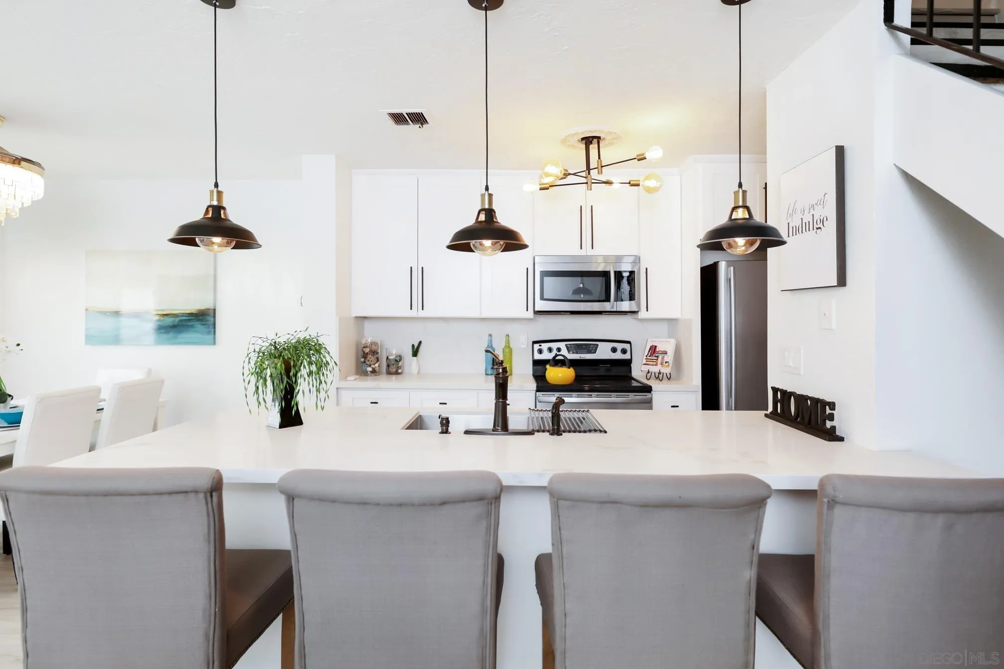 9845 Mission Gorge Road, Unit 3 Santee, CA 92071 - Photo 11 of 25 a kitchen with a sink a stove and a wooden floor