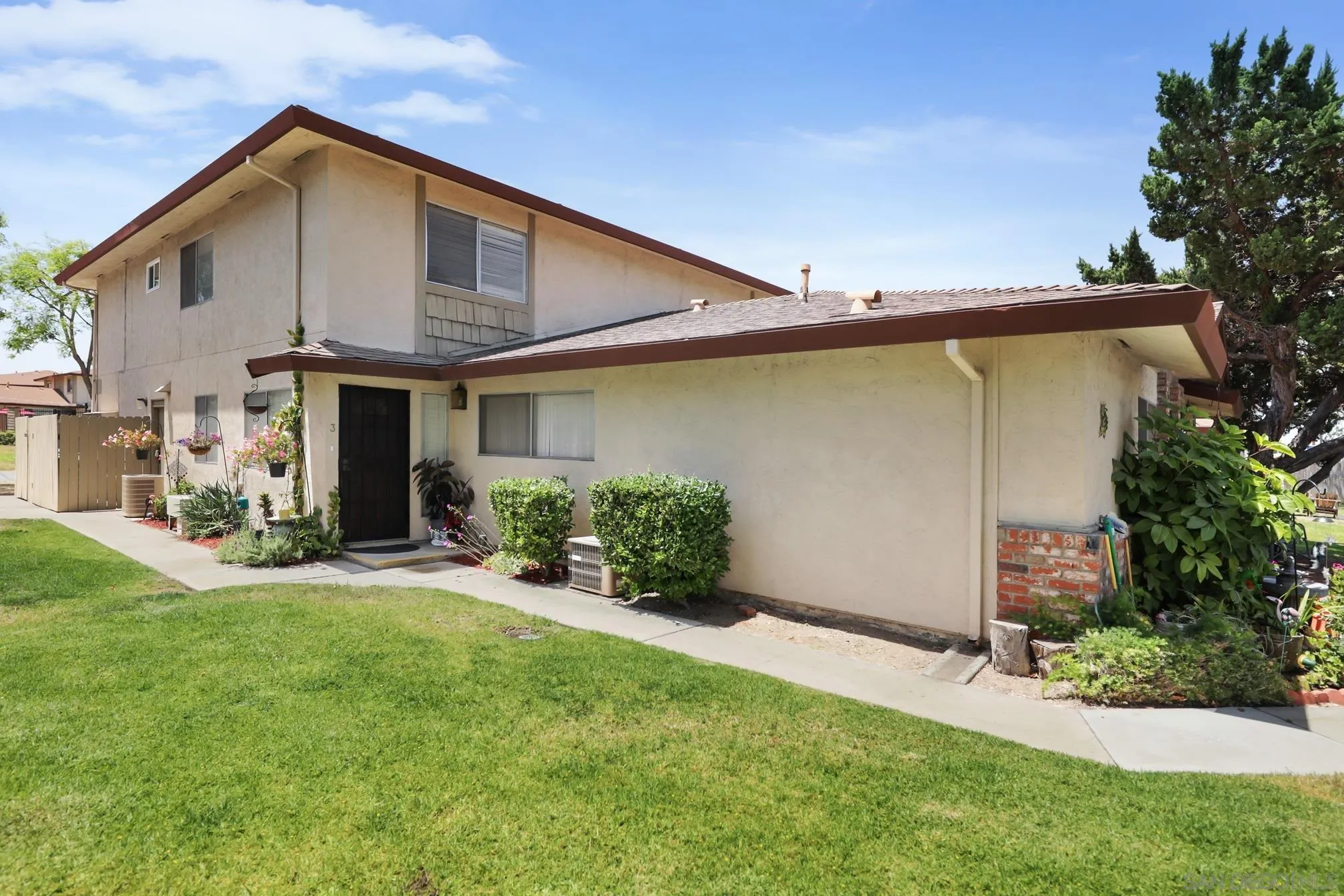 9845 Mission Gorge Road, Unit 3 Santee, CA 92071 - Photo 4 of 25 a front view of a house with a yard