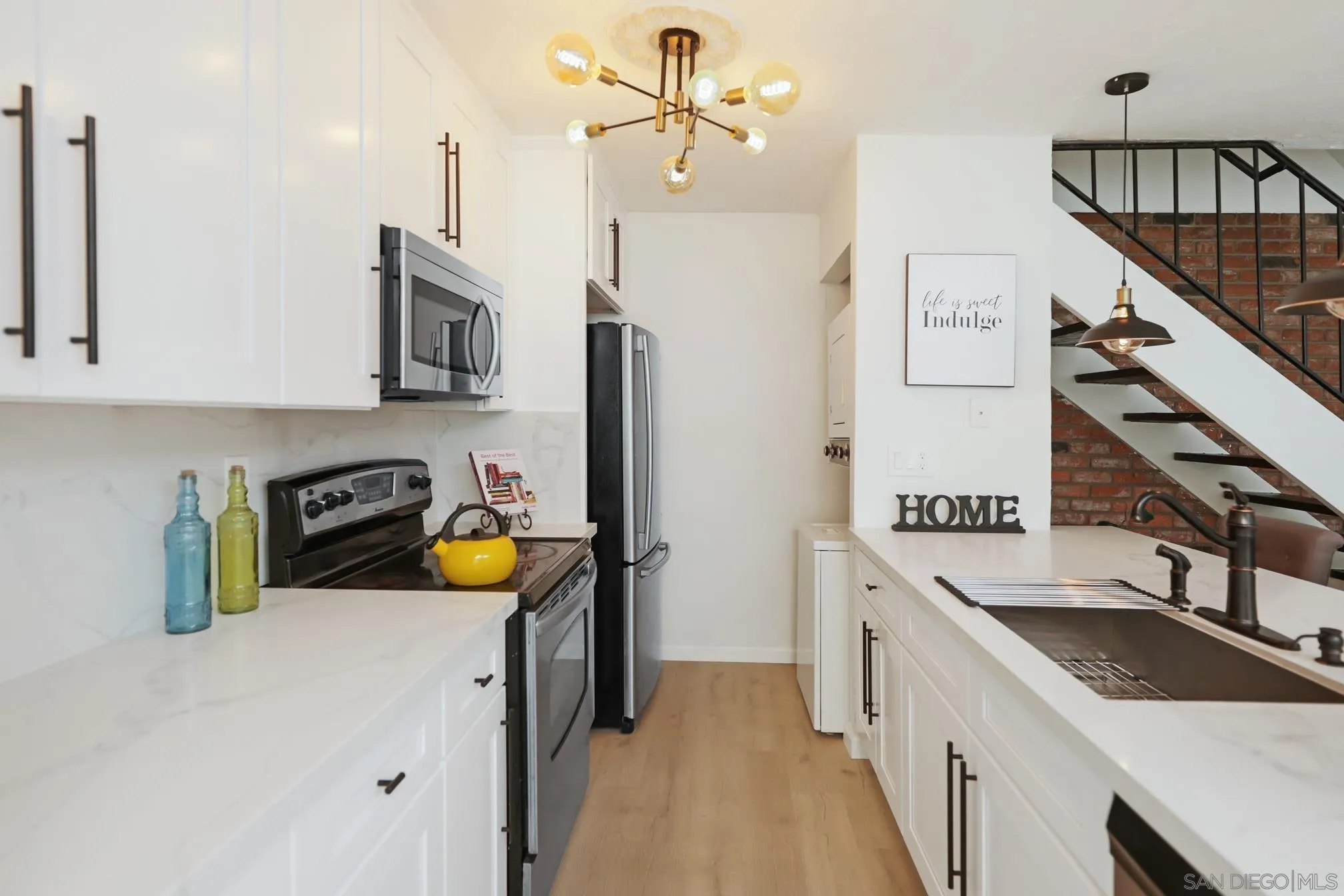 9845 Mission Gorge Road, Unit 3 Santee, CA 92071 - Photo 9 of 25 a kitchen with stainless steel appliances granite countertop a sink a stove and a refrigerator