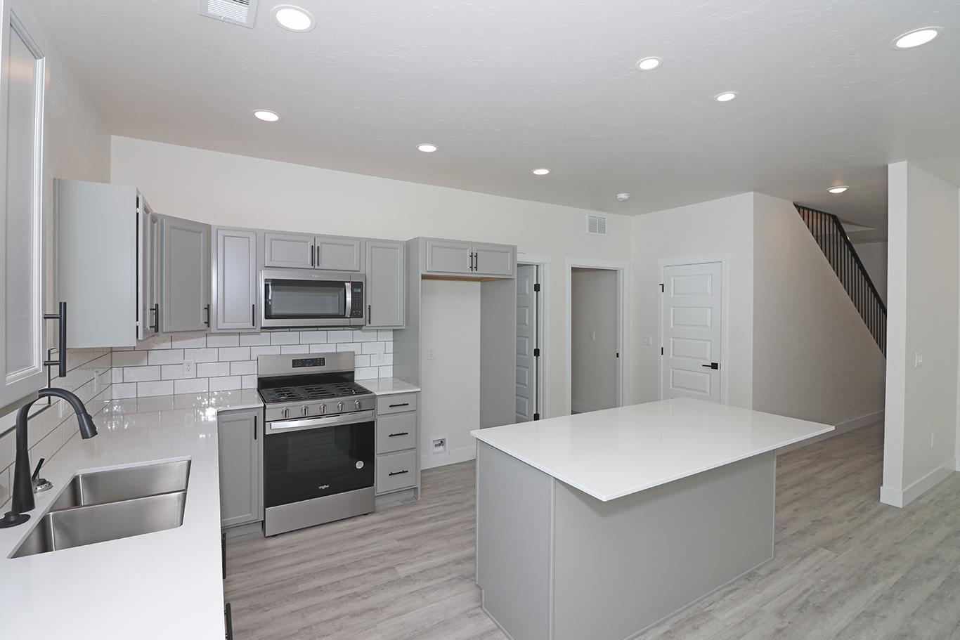 2450 Hamilton Road, Unit B Grand Junction, CO 81505 - Photo 12 of 29 a kitchen with stainless steel appliances a refrigerator sink and stove