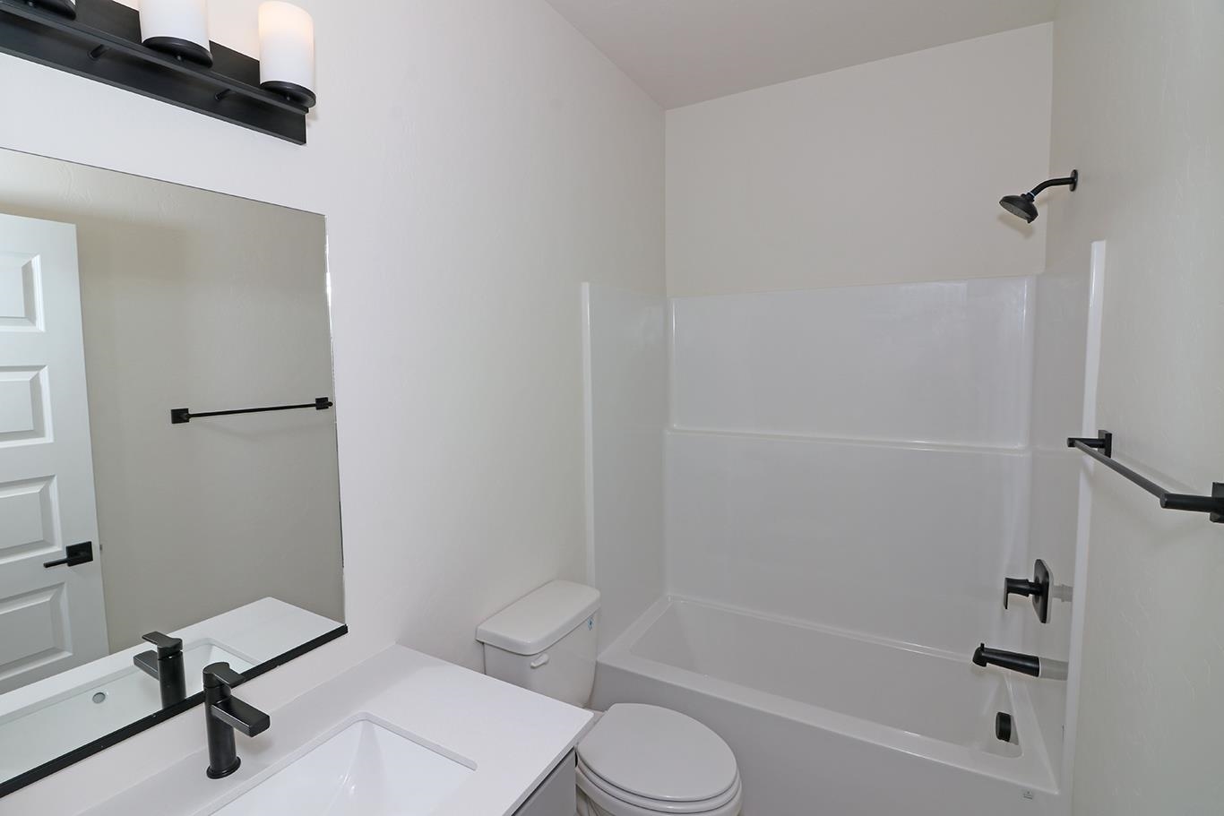 2450 Hamilton Road, Unit B Grand Junction, CO 81505 - Photo 18 of 29 a bathroom with a toilet and a bathtub