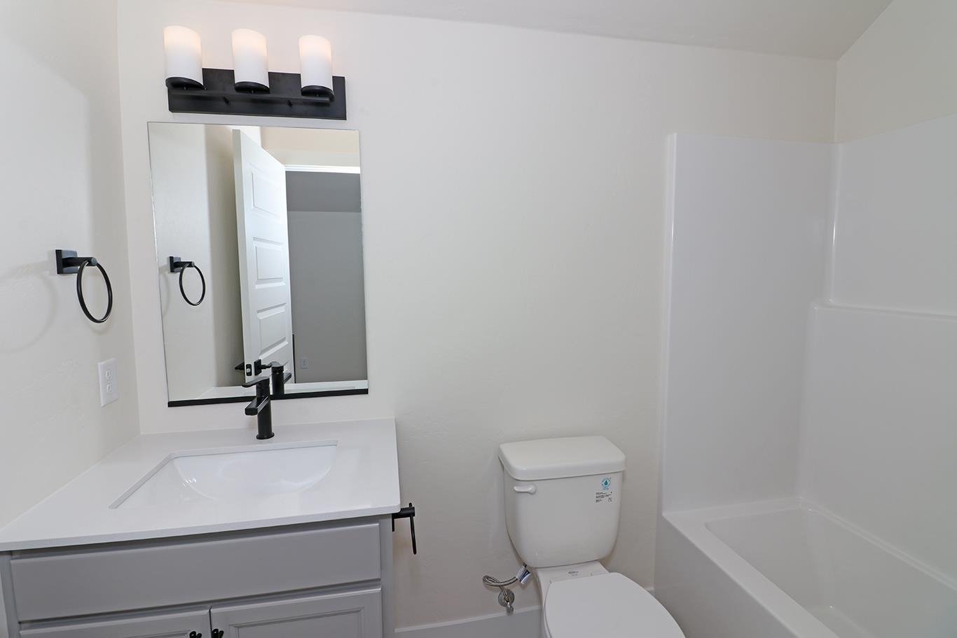 2450 Hamilton Road, Unit B Grand Junction, CO 81505 - Photo 19 of 29 a bathroom with a sink toilet and shower