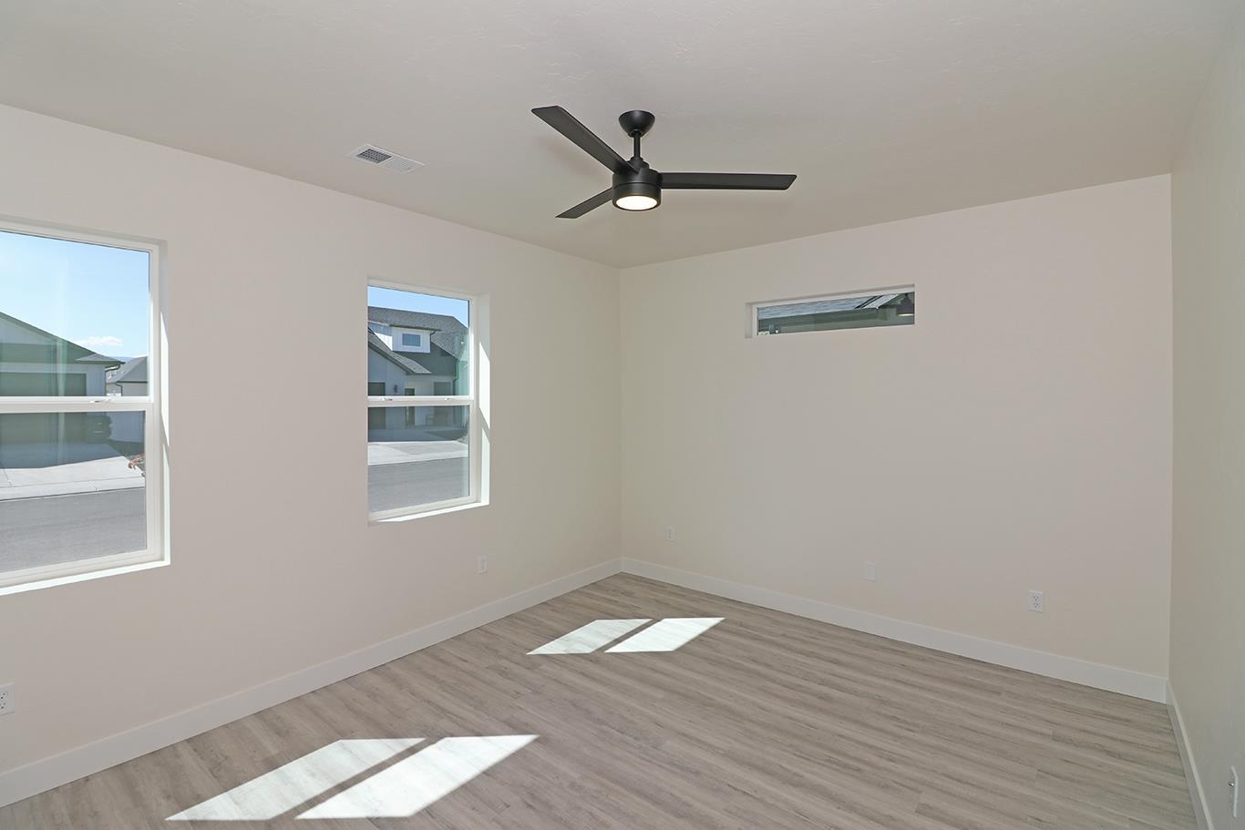 2450 Hamilton Road, Unit B Grand Junction, CO 81505 - Photo 20 of 29 a view of empty room with wooden floor and fan