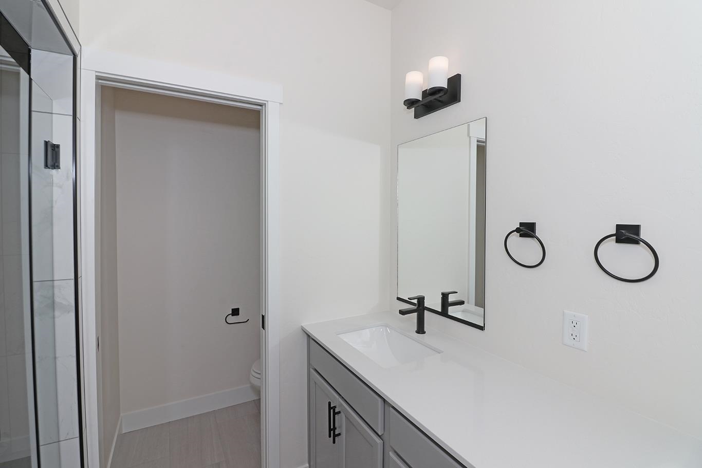 2450 Hamilton Road, Unit B Grand Junction, CO 81505 - Photo 23 of 29 a bathroom with a sink vanity and a mirror
