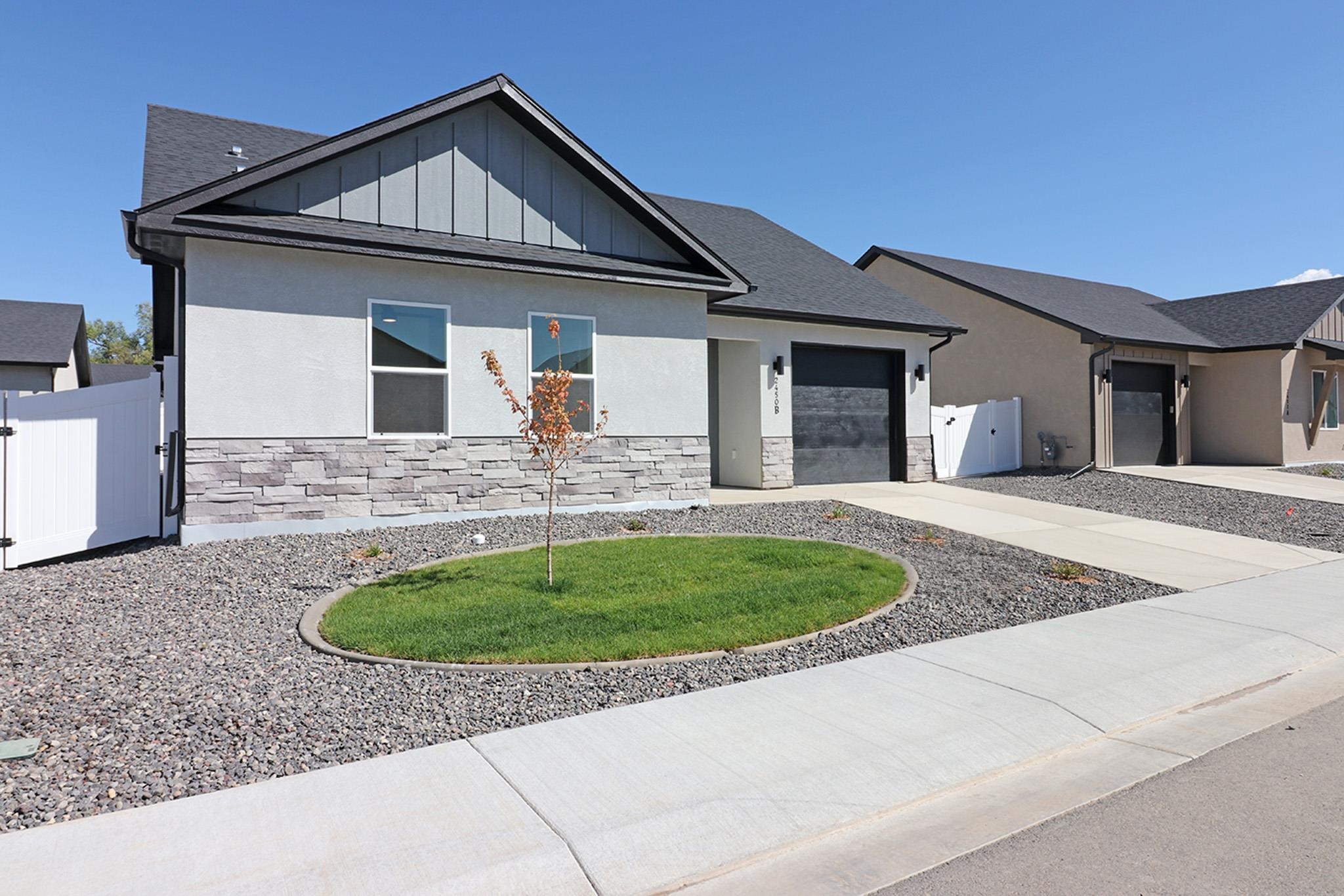 2450 Hamilton Road, Unit B Grand Junction, CO 81505 - Photo 3 of 29 a front view of a house with garage
