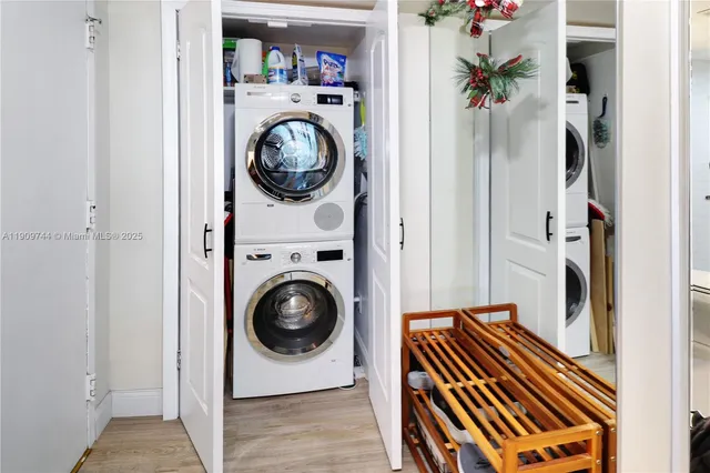a view of a hallway with washer and dryer
