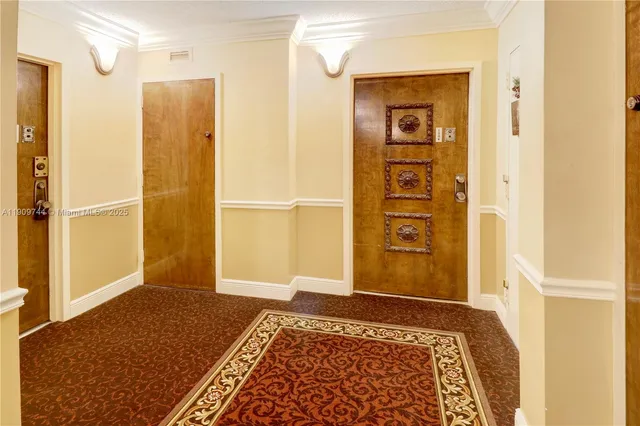 a living room with furniture and view of kitchen