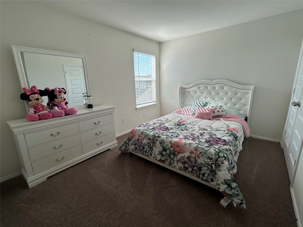 420 Lt. Rusty Jarrell, TX 76537 - Photo 14 of 17 Bedroom featuring dark carpet and baseboards