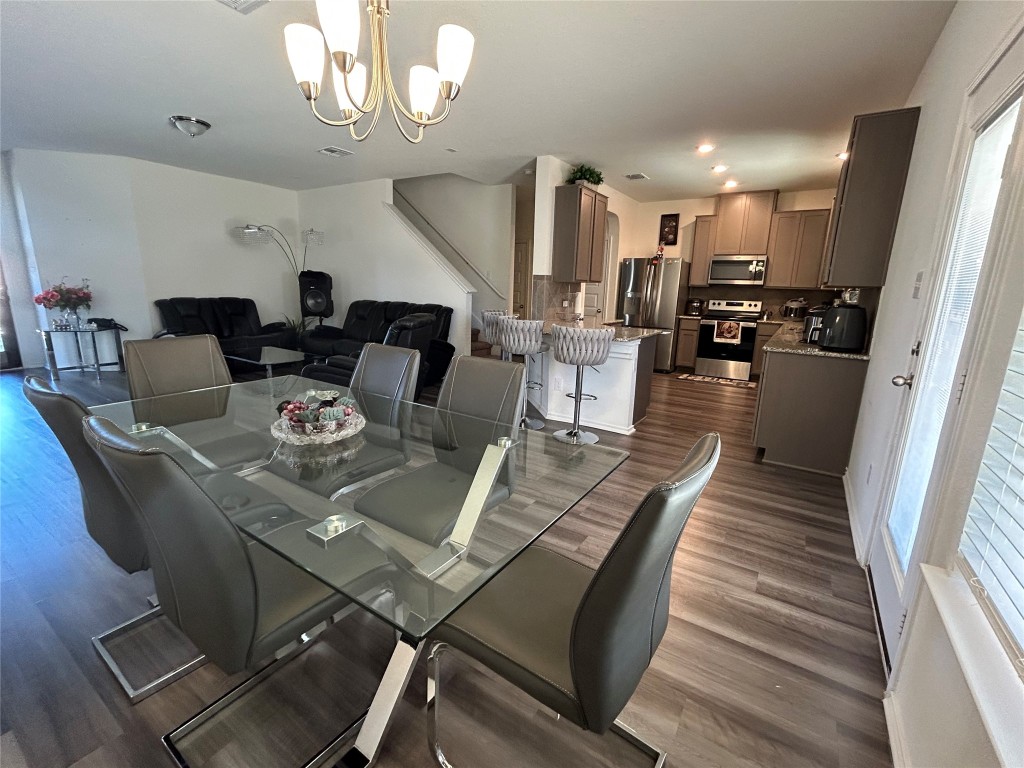 420 Lt. Rusty Jarrell, TX 76537 - Photo 6 of 17 Dining area featuring a chandelier, dark wood-type flooring, and recessed lighting