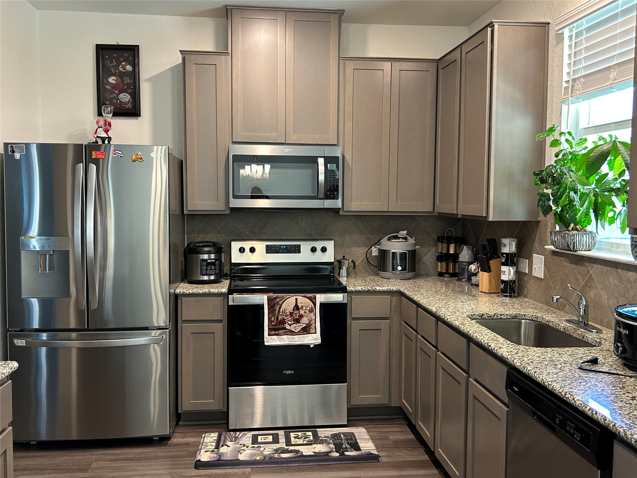 420 Lt. Rusty Jarrell, TX 76537 - Photo 8 of 17 a kitchen with a refrigerator sink and stove
