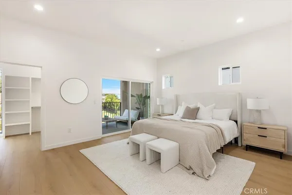 a room with a bed and a view of bedroom