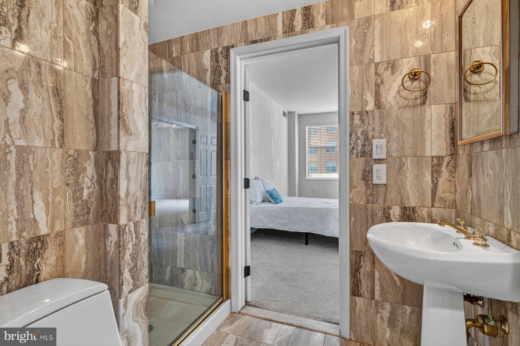 3801 Canterbury Road, Unit 403 Baltimore, MD 21218 - Photo 14 of 25 Elegant marble bathroom retreat.