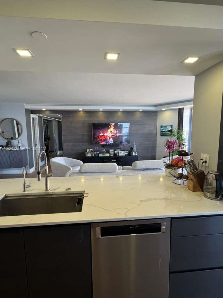 4000 Towerside Terrace, Unit 1901 Miami, FL 33138 - Photo 9 of 33 a view of a kitchen with kitchen island a sink and wooden floor