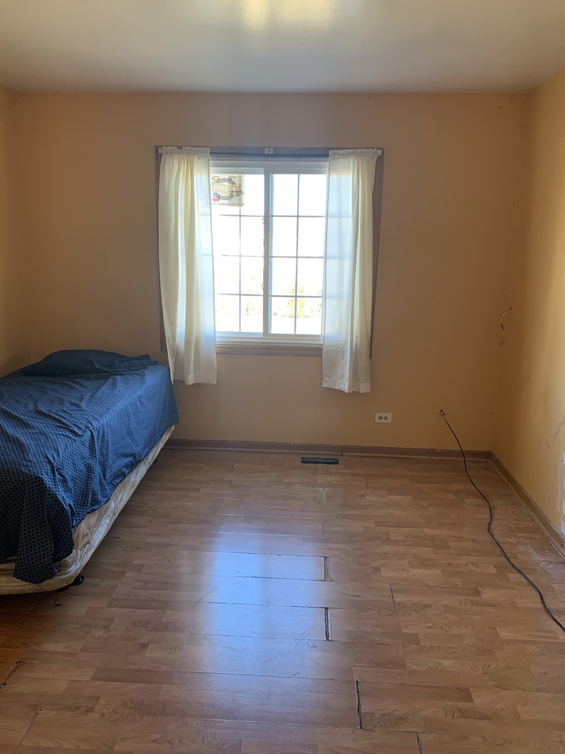 3815 River Road Hazel Crest, IL 60429 - Photo 18 of 25 a view of a room with wooden floor and window