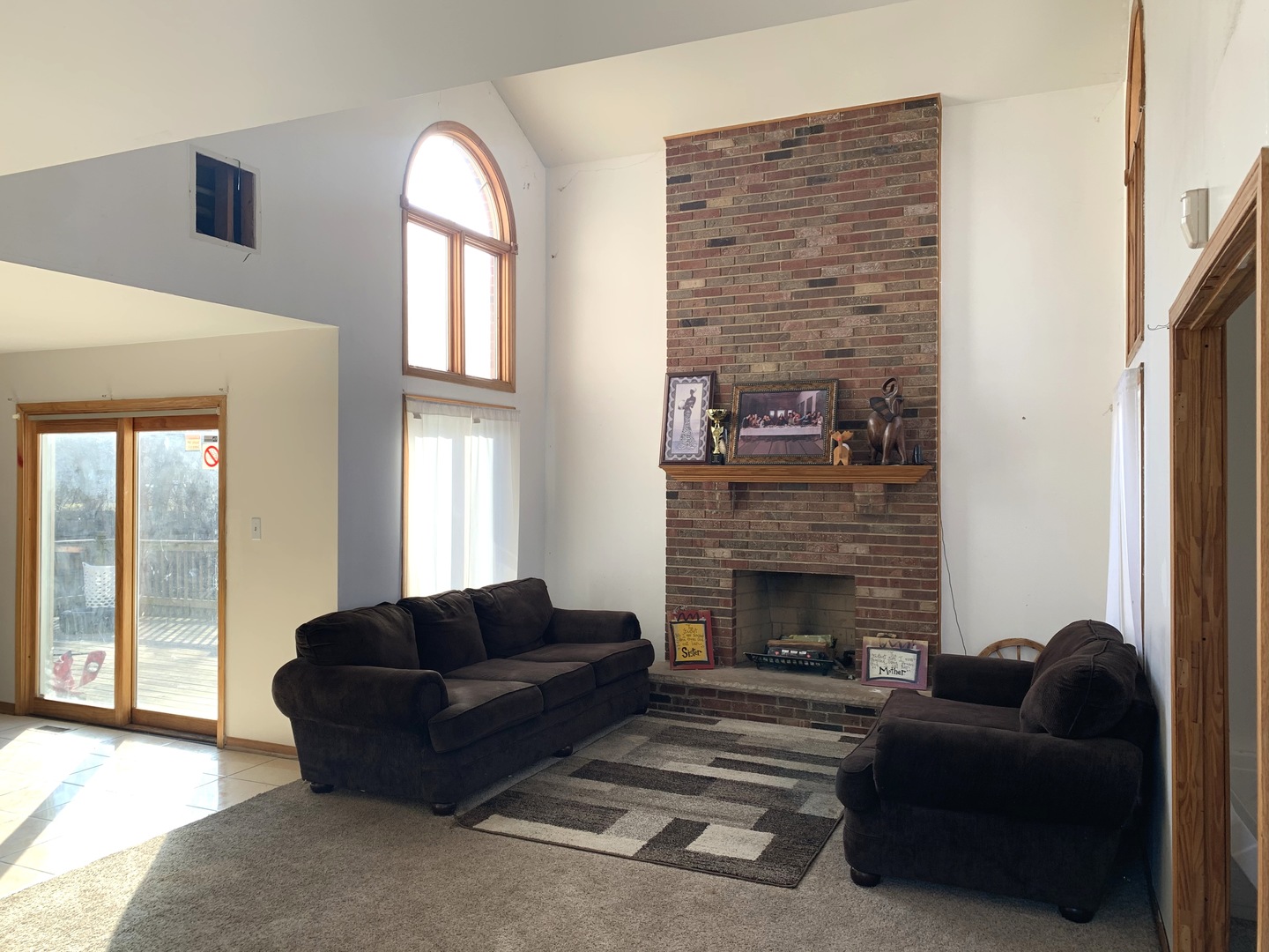 3815 River Road Hazel Crest, IL 60429 - Photo 8 of 25 a living room with furniture a fireplace and a large window