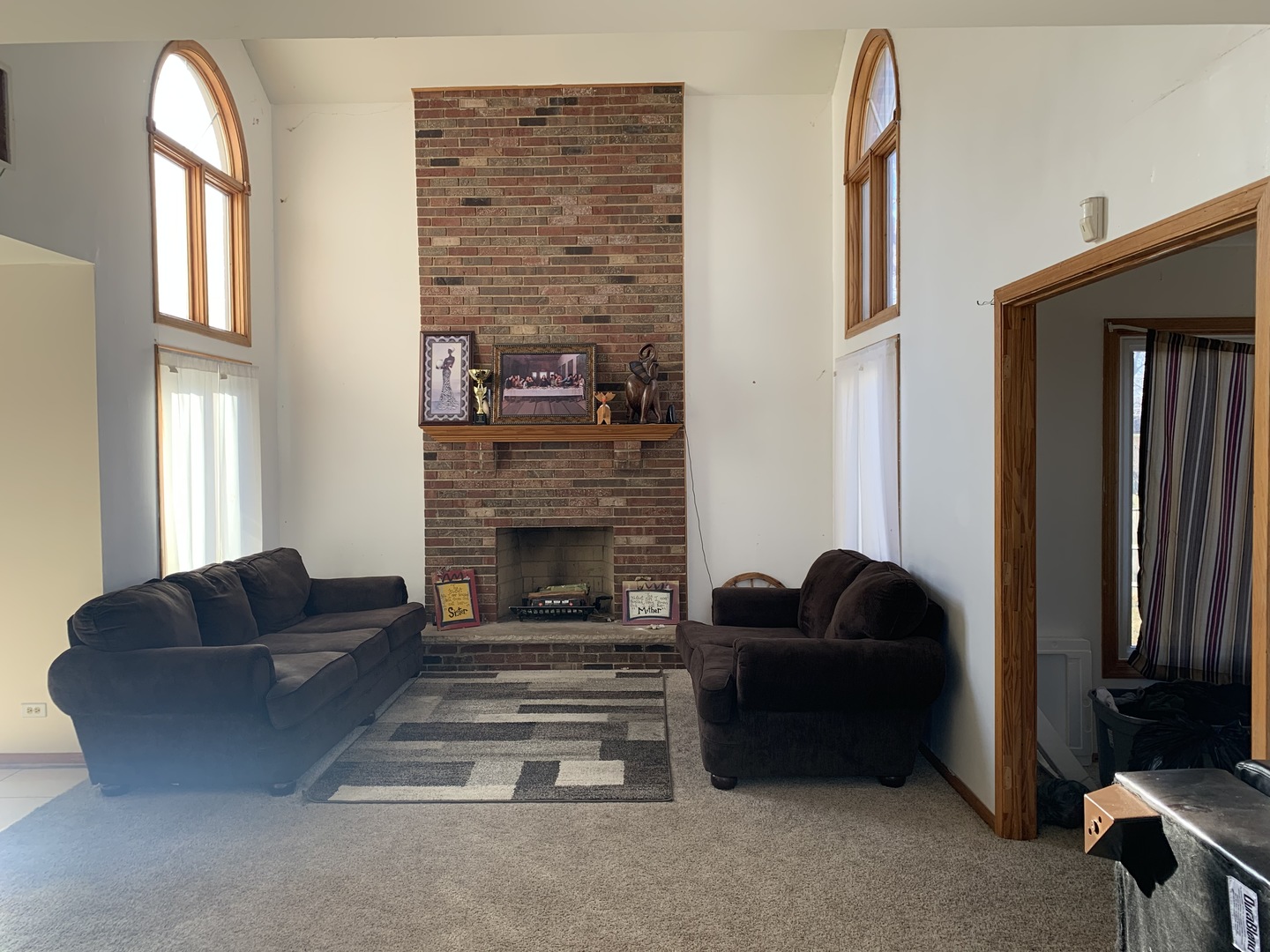 3815 River Road Hazel Crest, IL 60429 - Photo 9 of 25 a living room with furniture a fireplace and a large window