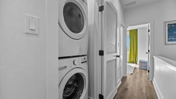 a view of a hallway with washer and dryer