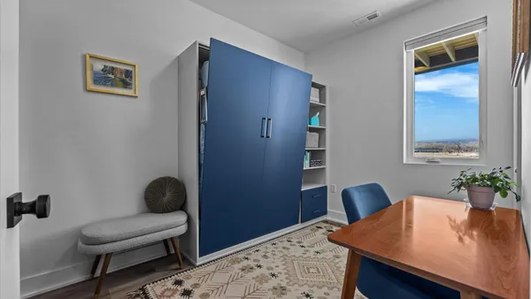 a workspace with furniture and rug