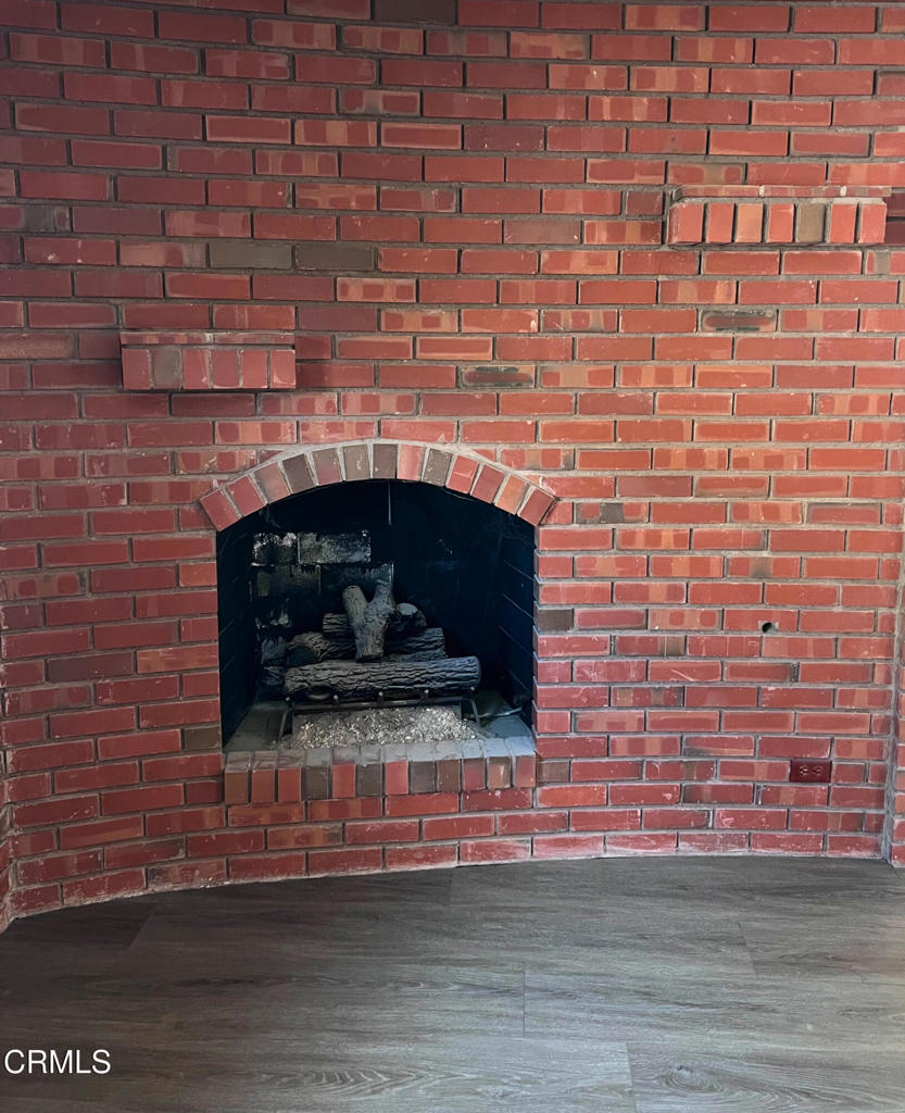 10945 Kings Road Ventura, CA 93004 - Photo 14 of 19 a living room with a fireplace