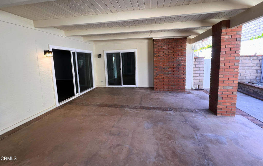 10945 Kings Road Ventura, CA 93004 - Photo 19 of 19 a view of an empty room with a fireplace and a window