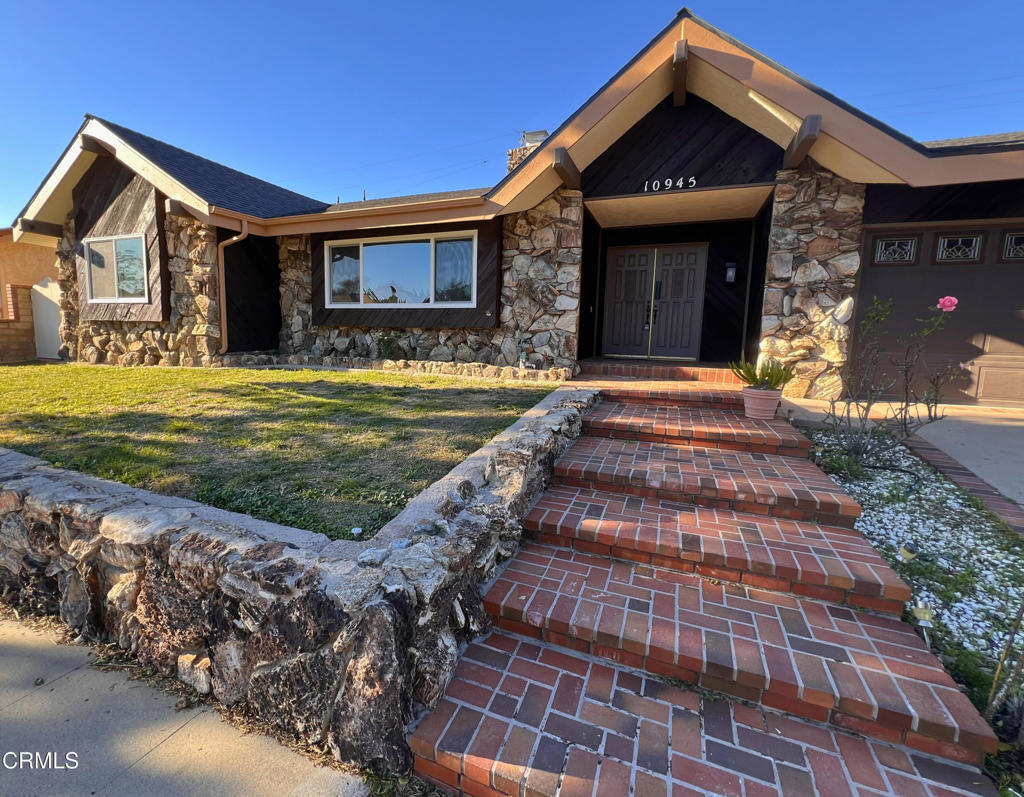 10945 Kings Road Ventura, CA 93004 - Photo 2 of 19 a front view of a house with garden