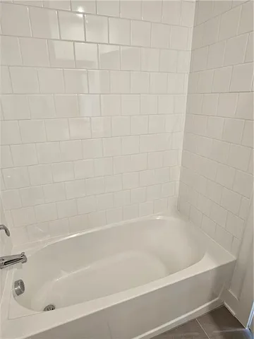 a close up of a bathtub in bathroom