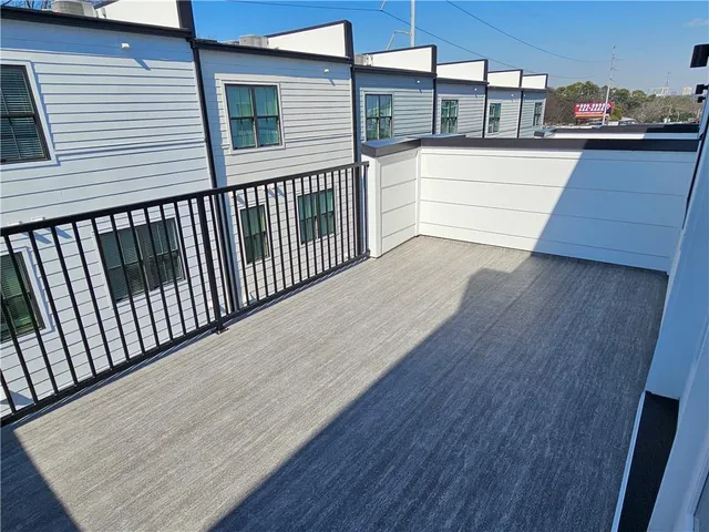 a view of a balcony with wooden floor