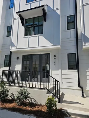a view of a house with a small yard
