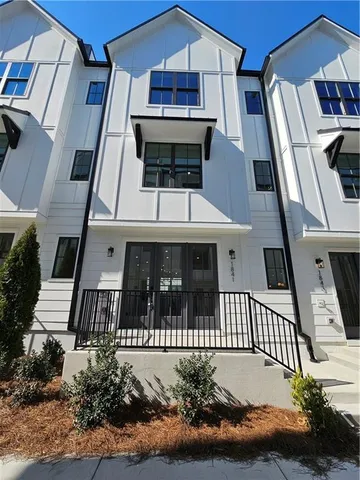 front view of a house with a small yard