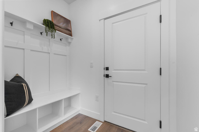 342 North Rhyolite Drive, Unit 88 Hurricane, UT 84737 - Photo 10 of 26 Entryway featuring a built-in bench with storage cubbies, white wainscoting with coat hooks and a display shelf