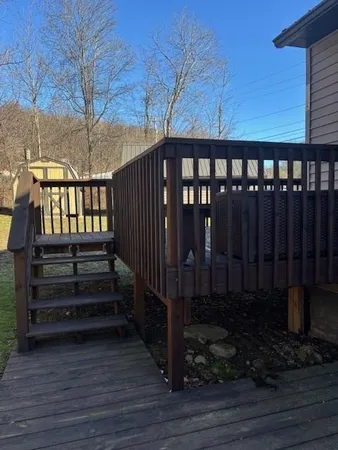 a view of a porch with wooden floor